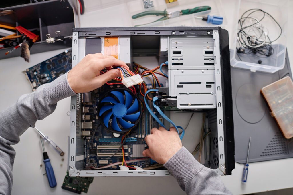 Unrecognizable Technician Repairing System Unit Computer 1024x683